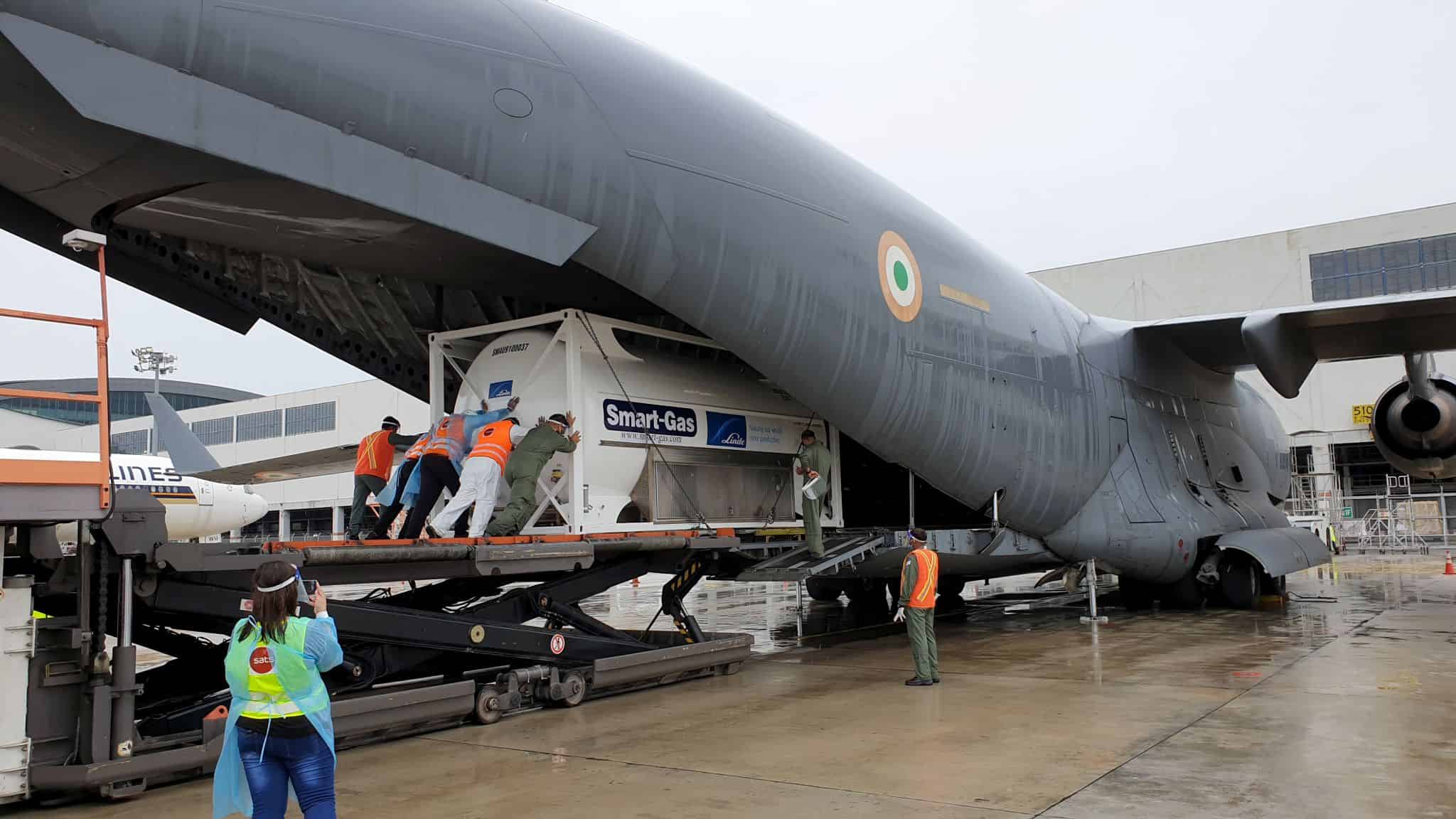 oxygen concentrators being loaded onto the IAF plane